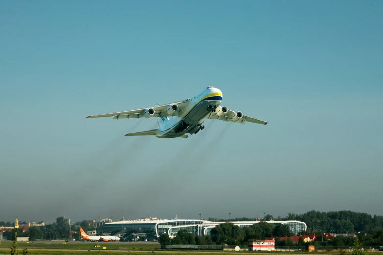 an airplane is landing at an airport on a clear day