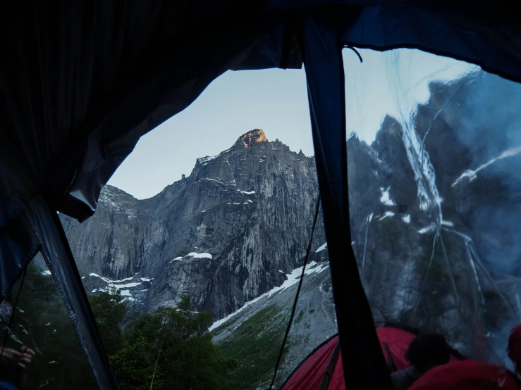 a view from inside a tent of the mountains