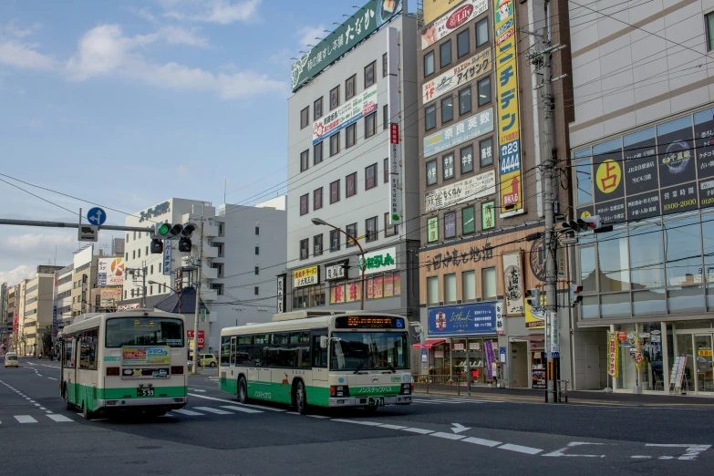 a couple of buses on the side of the street