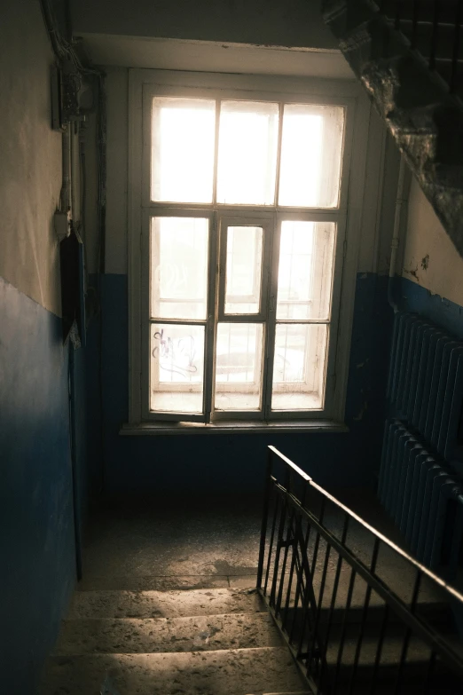 an image of a dimly lit room with stairs