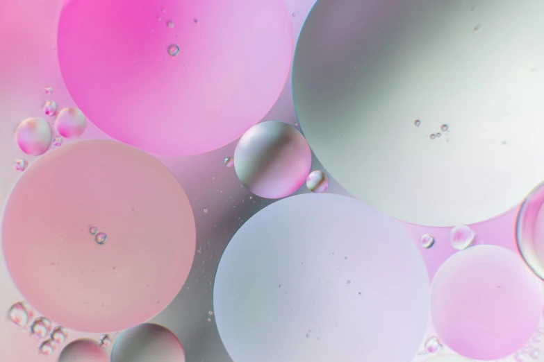 several different colored bubbles on a surface