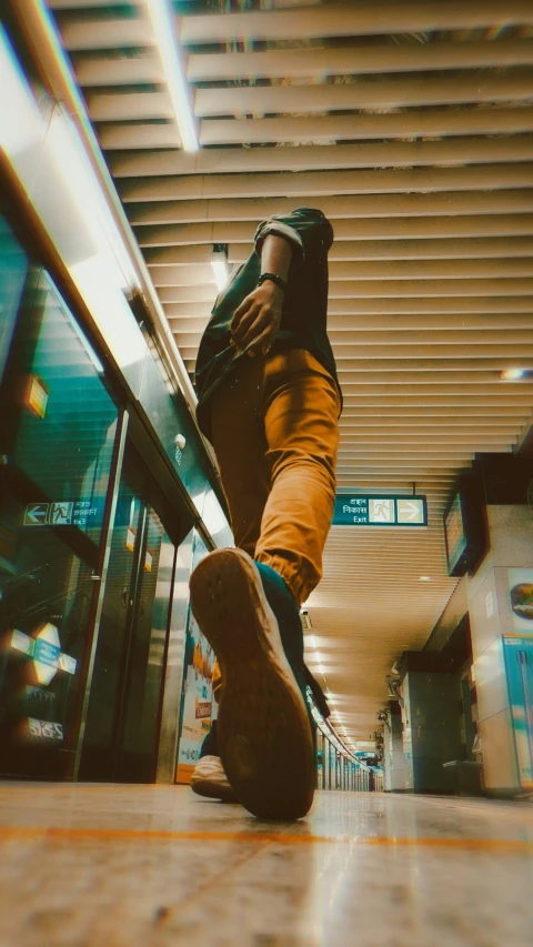 the person is riding their skateboard on an escalator