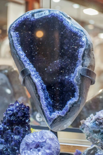 a large piece of blue and purple rock in a museum