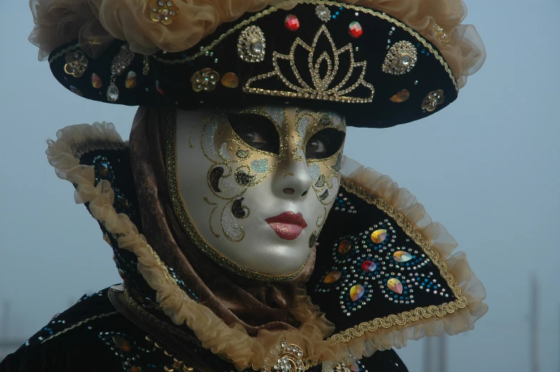 a close up s of a lady with an elaborate mask