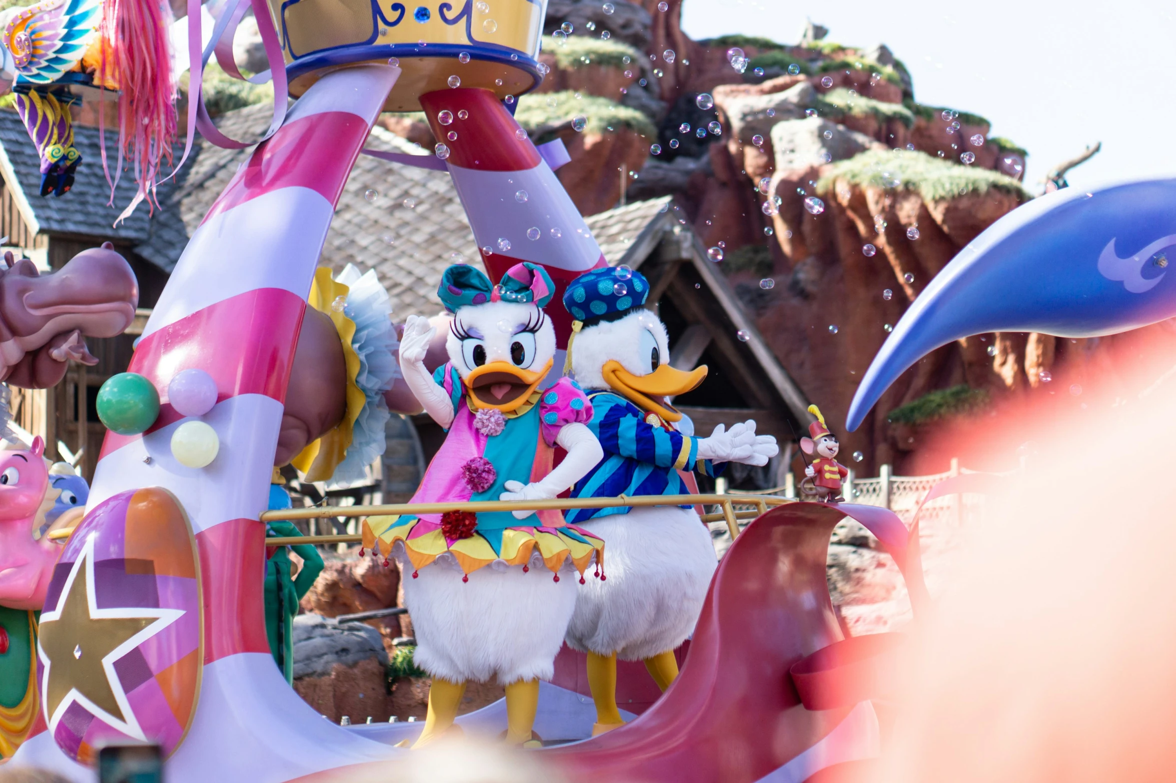 a crowd of people standing around an animal float