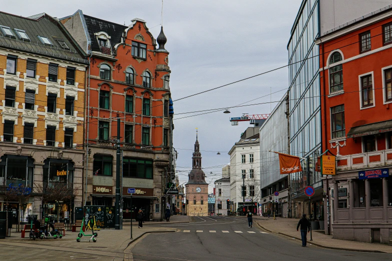 a city street lined with buildings and people walking