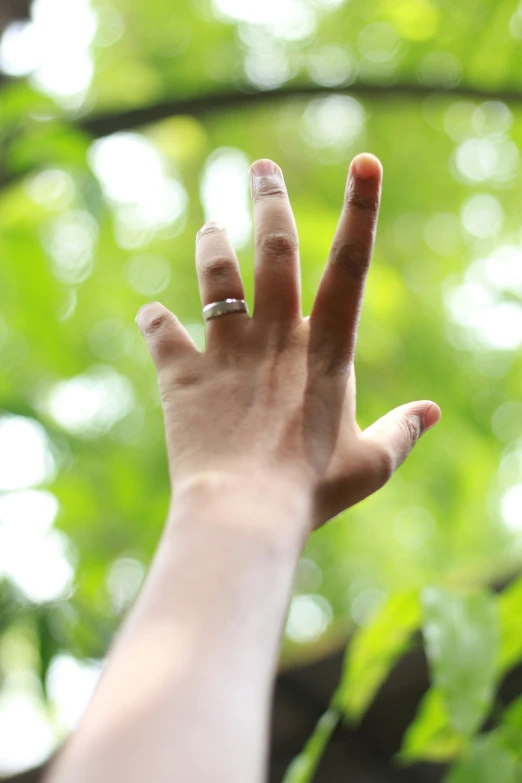 a woman's hand making the okay gesture with her fingers