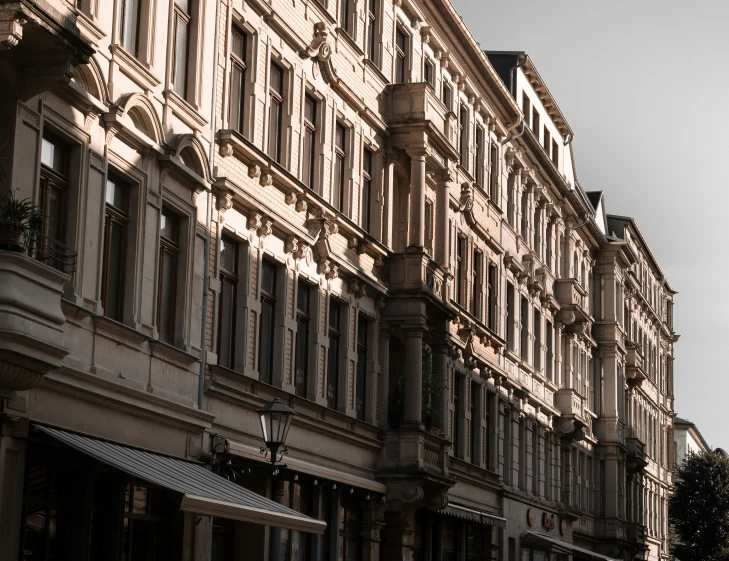 a city street with tall buildings next to it