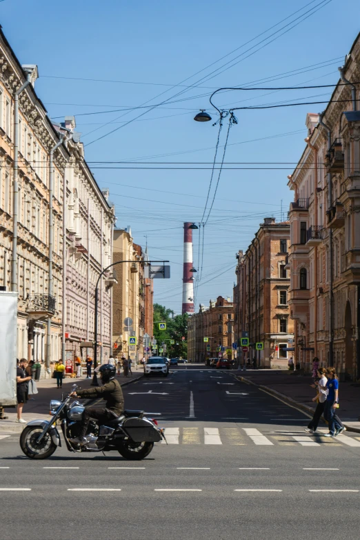 a motorcycle on the street behind another motorcycle in the distance