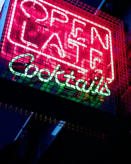 a neon sign is shown above the glass windows