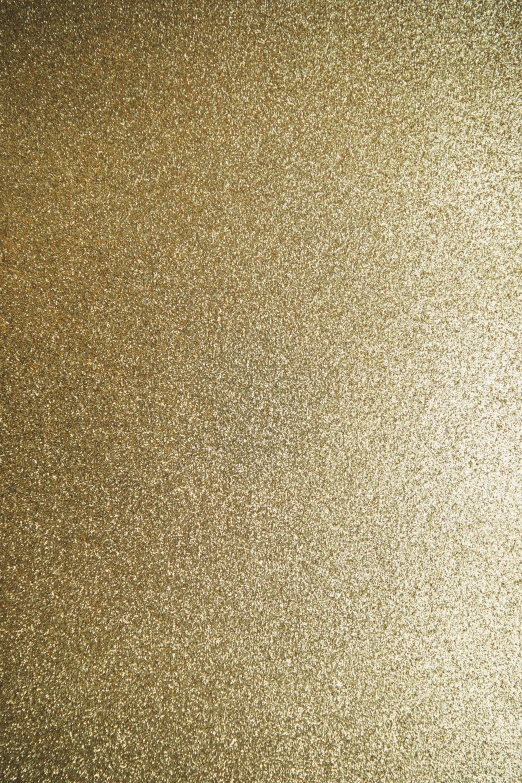 a dark brown colored textured background with small speckles