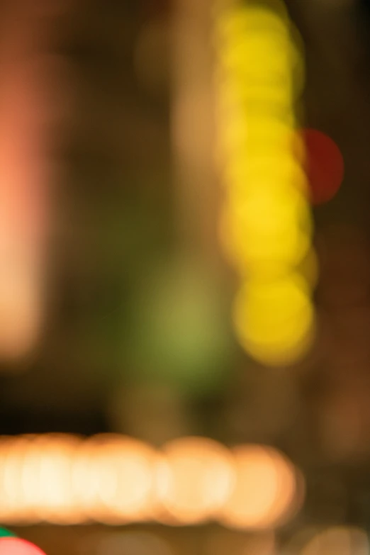 a blurred city street at night with traffic lights