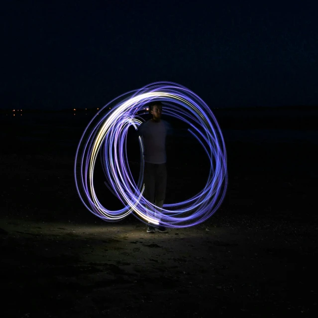 a person is standing and doing soing with blue light