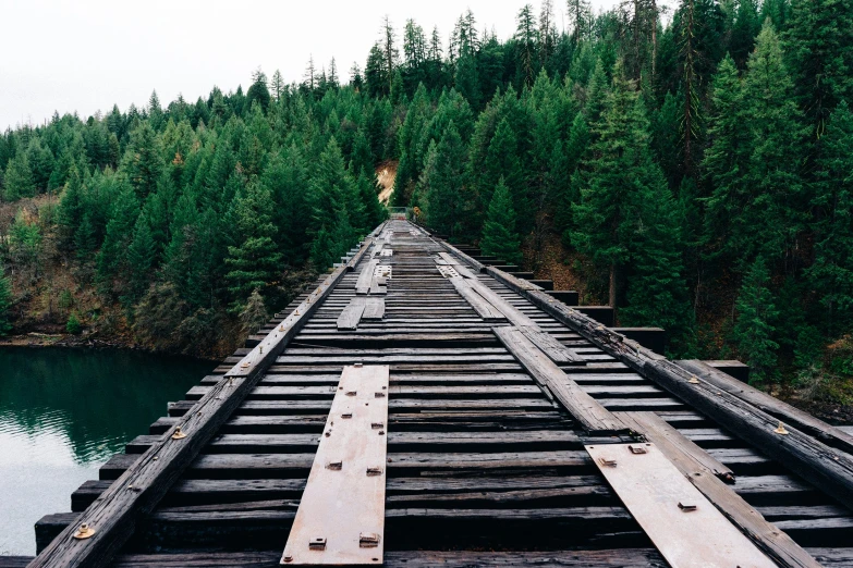 a bridge on the side of a body of water