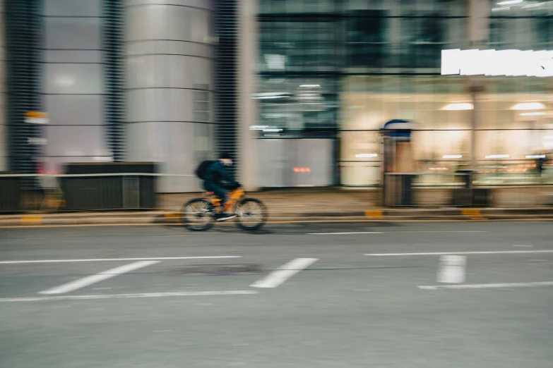 a man riding on the street in an urban setting