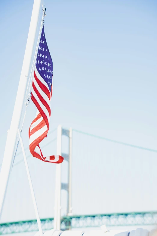 an american flag hanging on the side of a boat