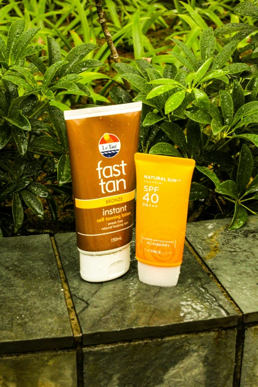 a sunscreen cream sitting next to a gel in a cup
