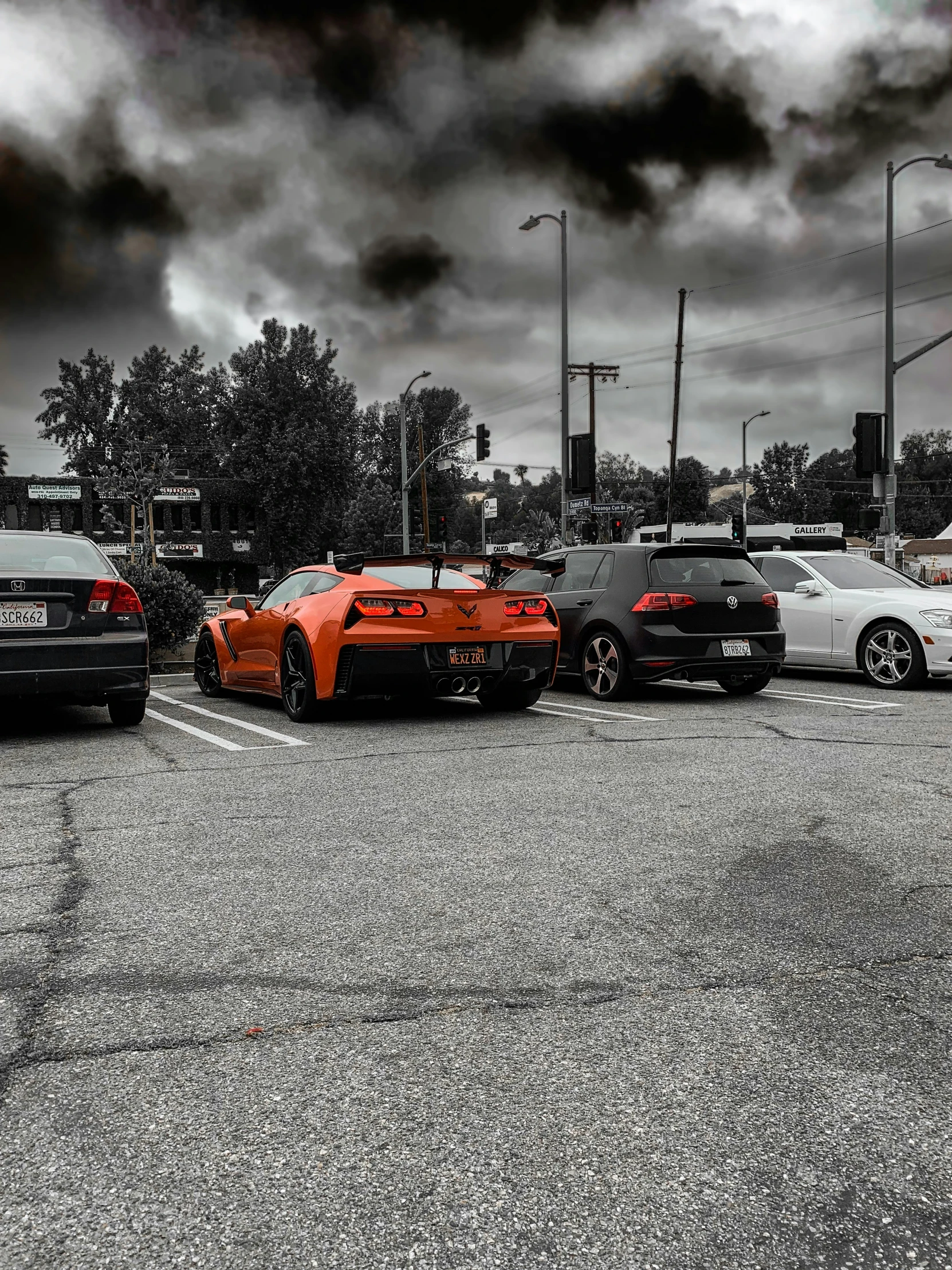 a parking lot with cars parked next to each other