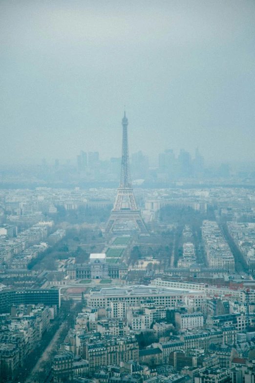 the eiffel tower sits high above the city