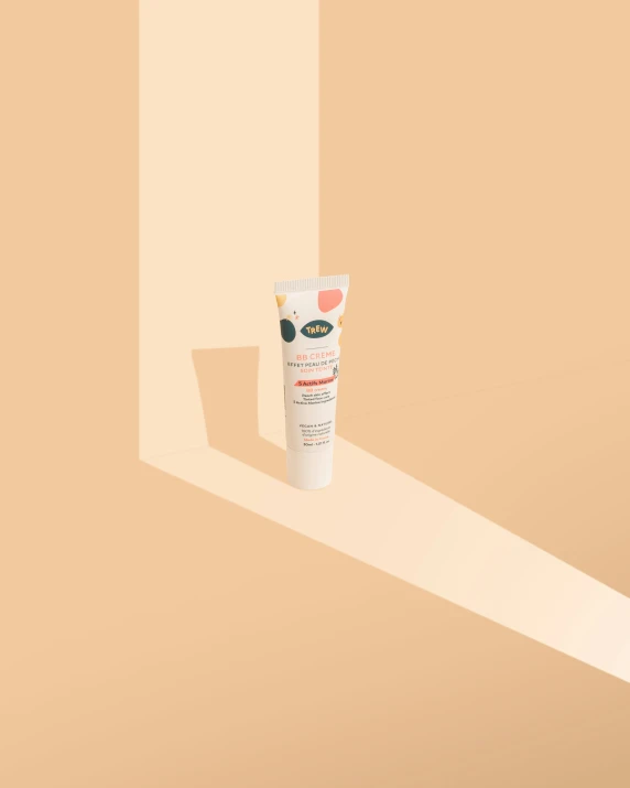 a tube of suncreen cream against a background