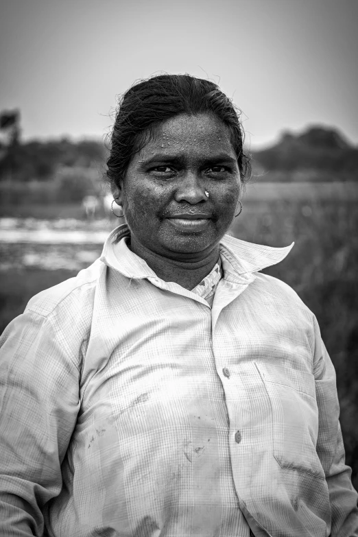 the young woman is smiling and posing for the camera