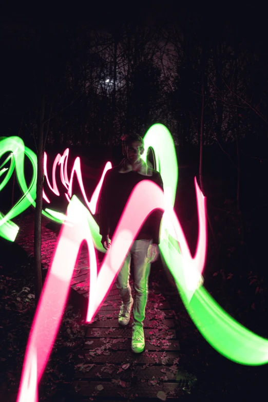 a person that is walking with a light in their hands