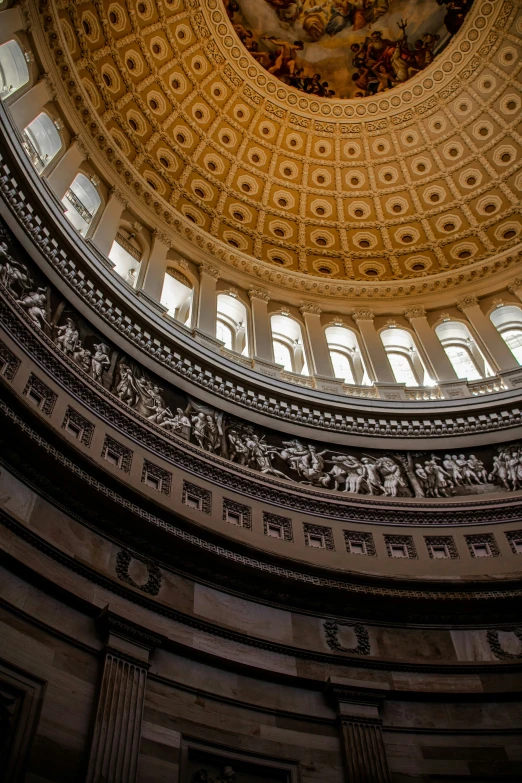 inside view of the dome of a building with artwork on it