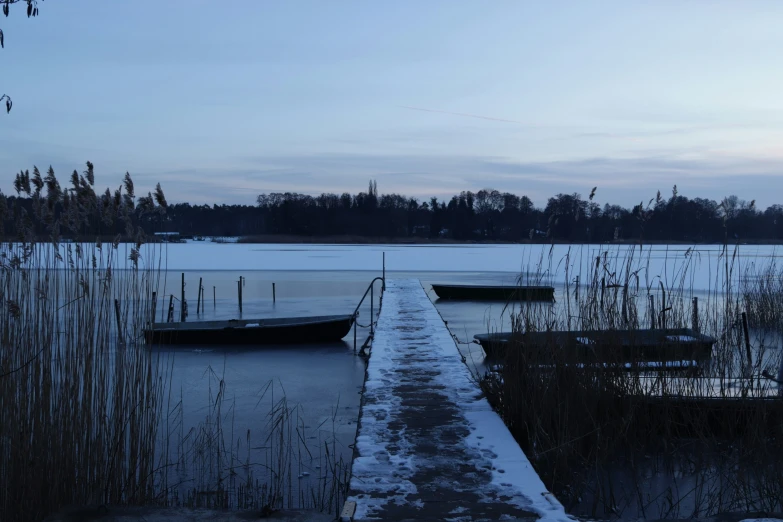 some boats that are floating on some water