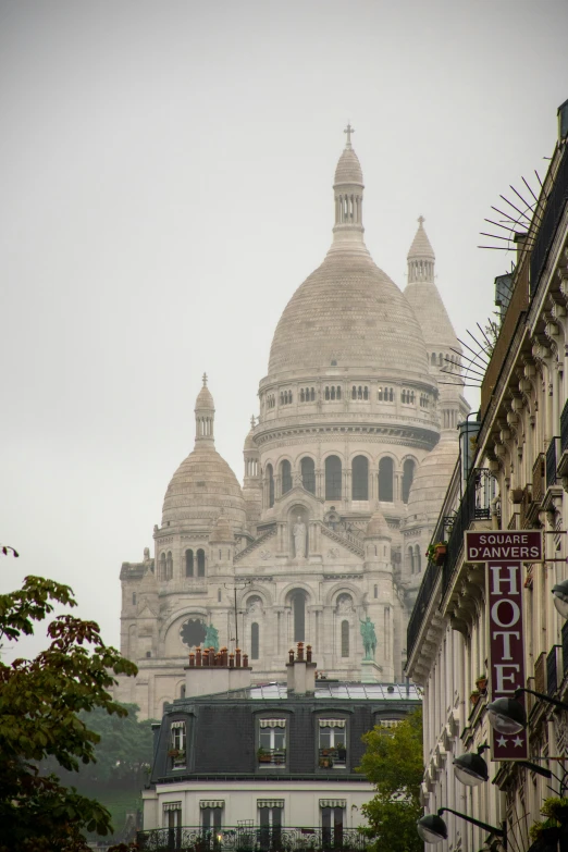 the cathedral is seen on a foggy day