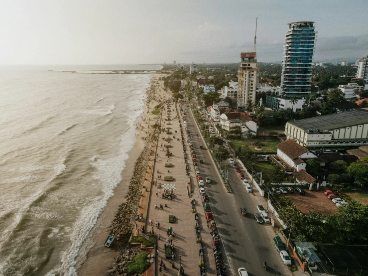 an empty beach and several long cars on it