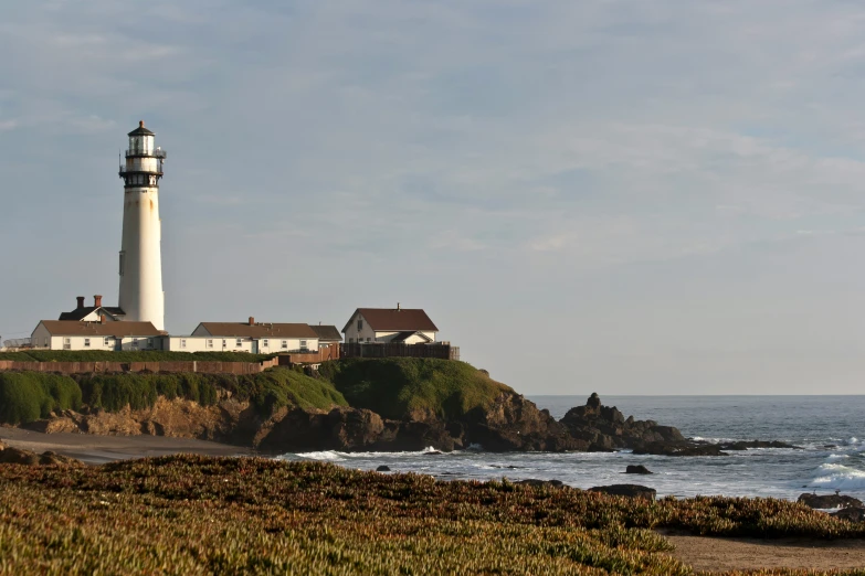 an island on the coast with a light house