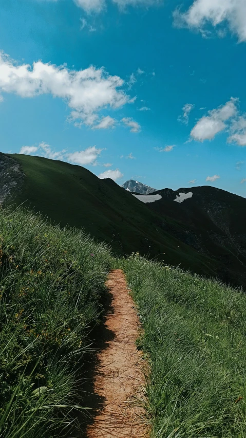 an image of a trail going through the mountains