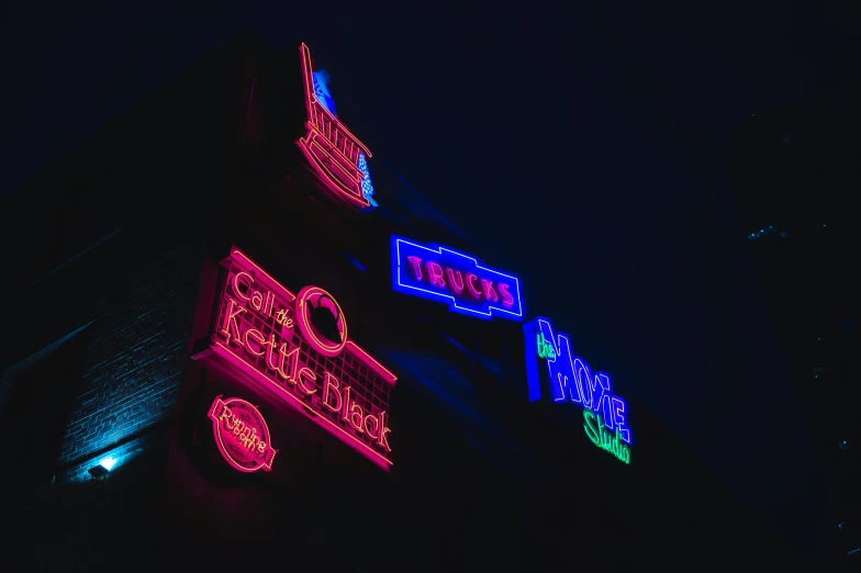 multiple lights adorn the side of a building