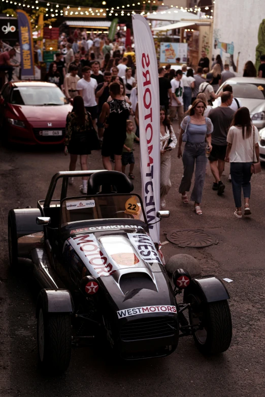 an electronic racing car with a motor and an antenna on top