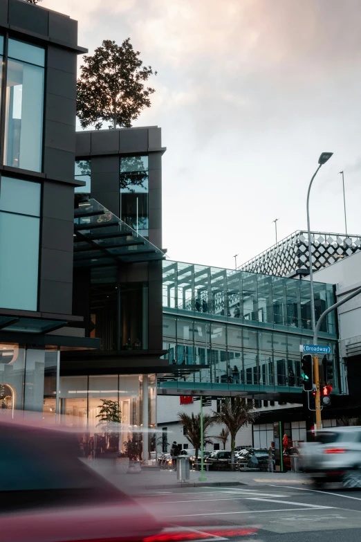 a view of buildings with cars passing on the street