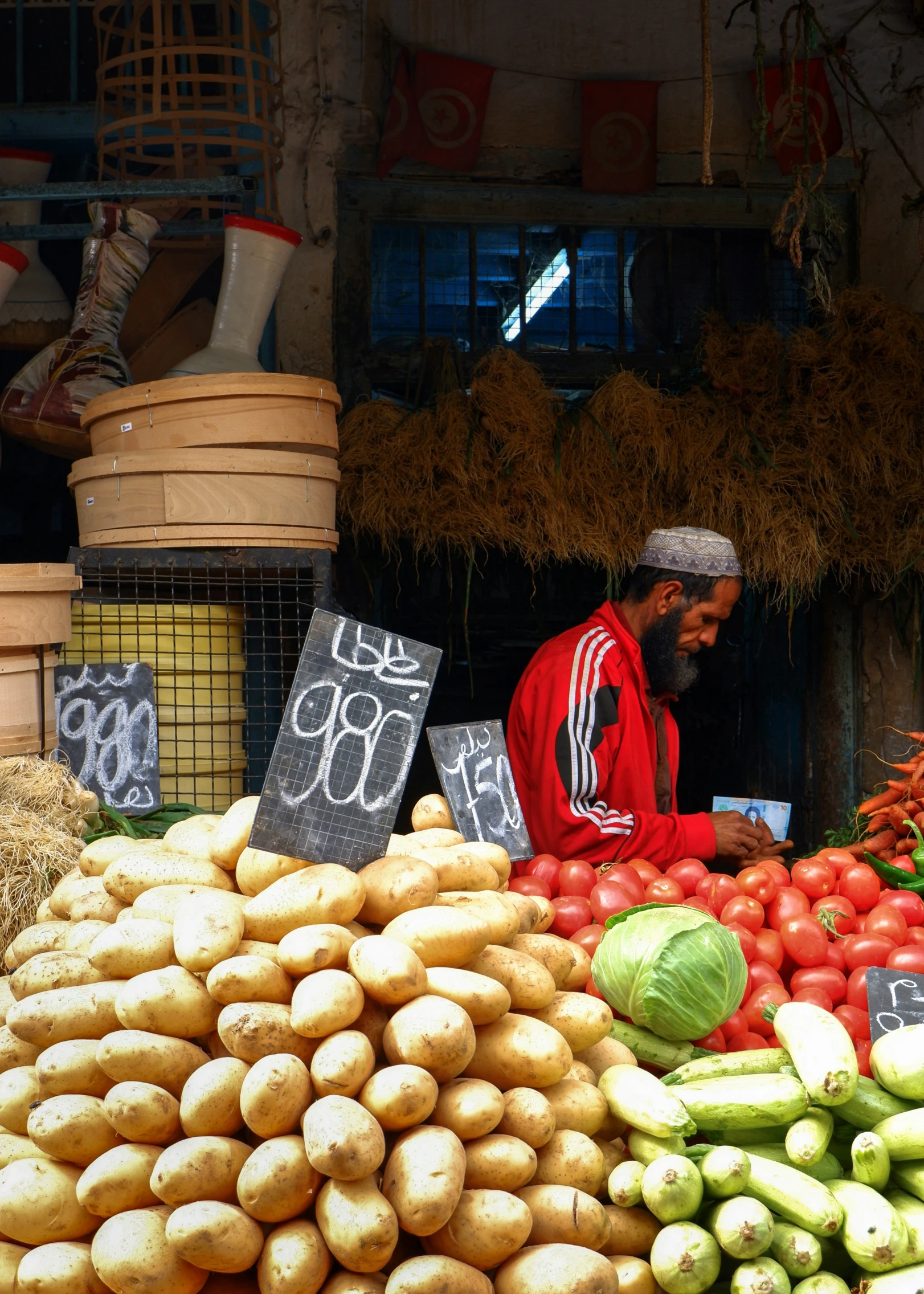 an outdoor farmers market selling a variety of vegetables