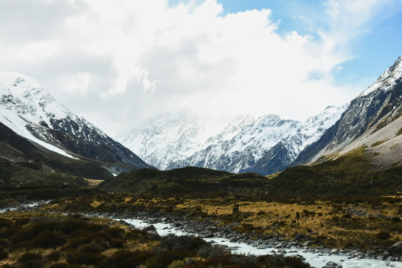 the mountains have a little snow on them