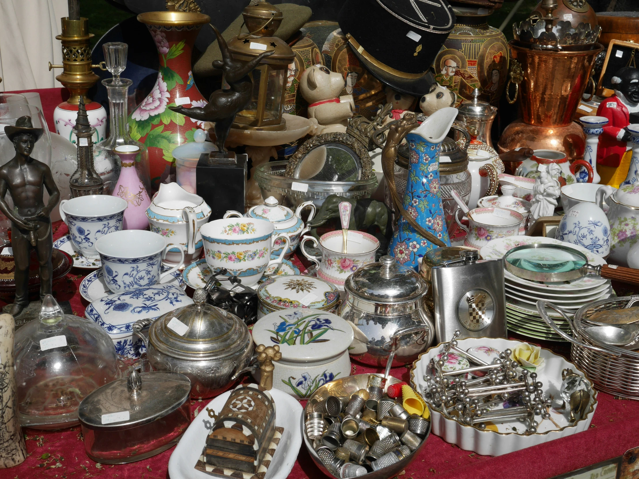 a table topped with lots of plates and bowls filled with candy