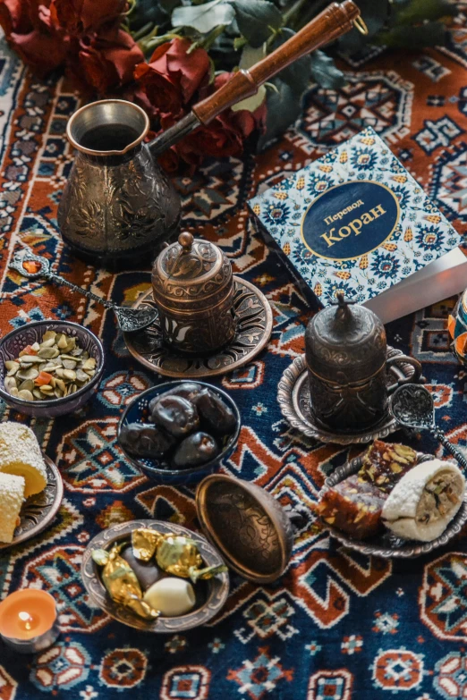 an oriental table with various dishes and items laid out on it