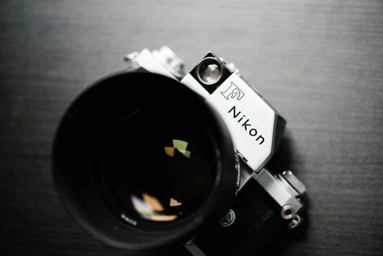 a camera lens with the nikon logo