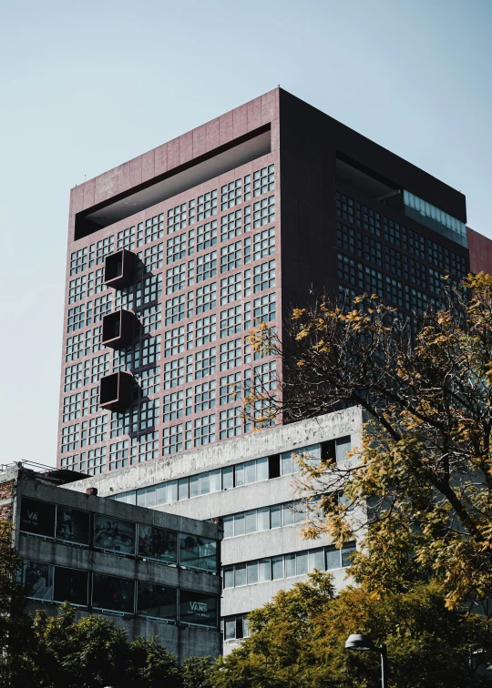 the skyscr building has a large brick face in the city