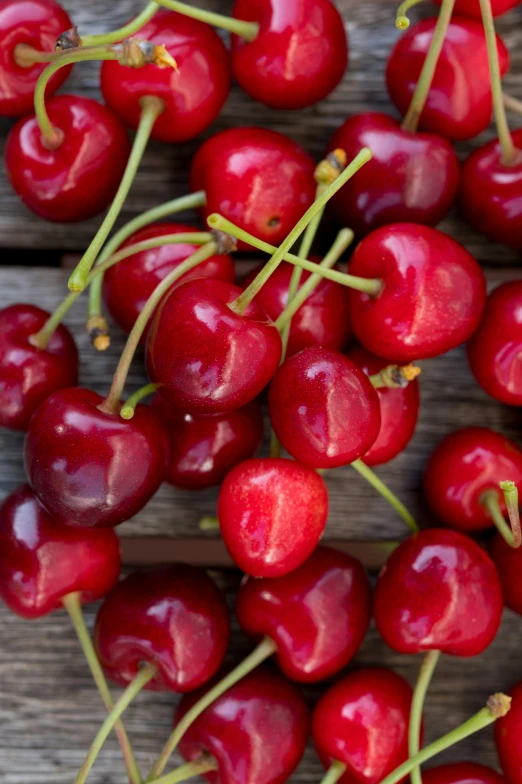 a bunch of cherries are sitting on a table