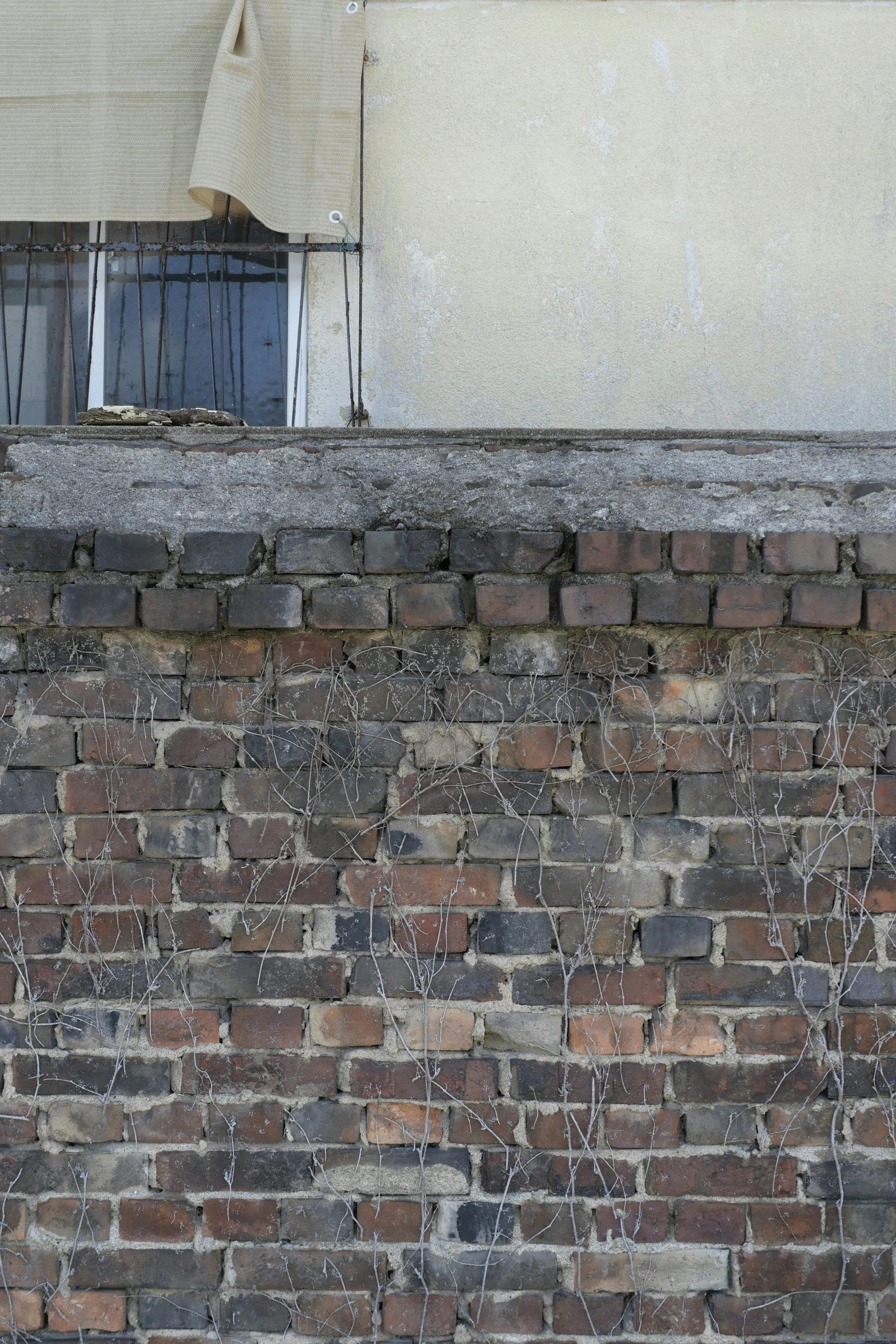 the side of a wall with a window next to it