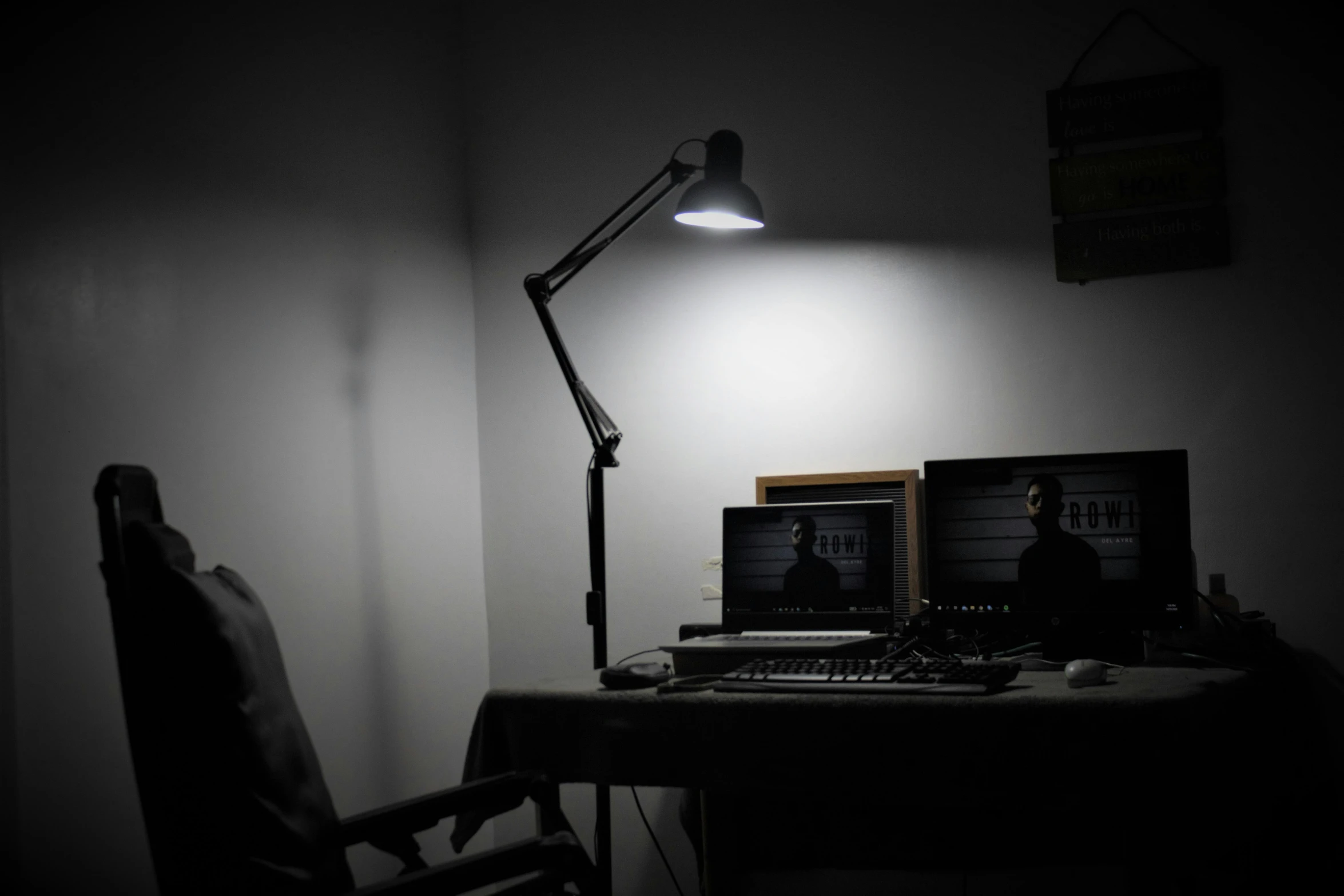 two computer screens on top of a desk