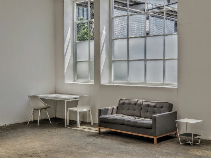 an image of a room with windows and a couch