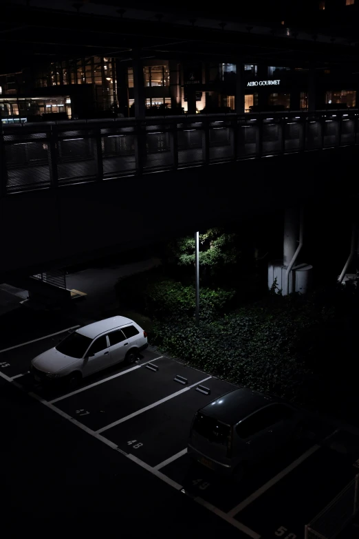 a parking lot at night lit up by lights