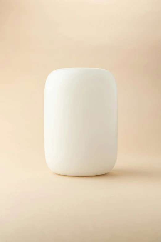 a white ceramic container sitting on top of a floor