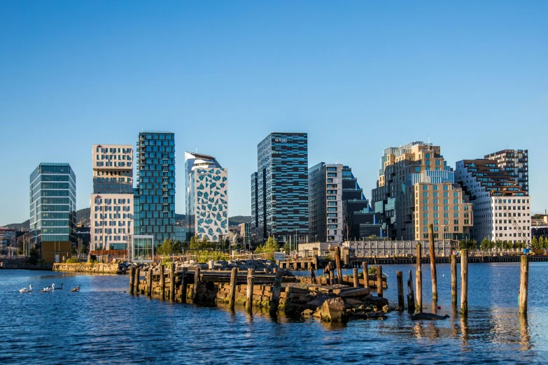 a view of city buildings across the water