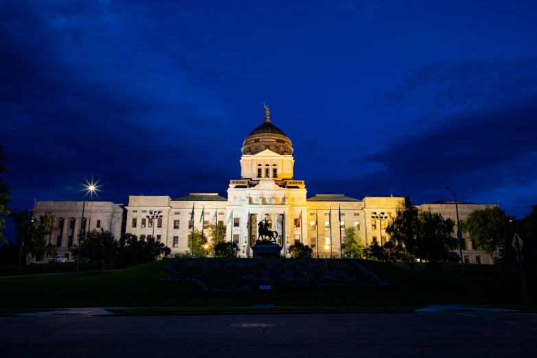 a white building is lit up at night