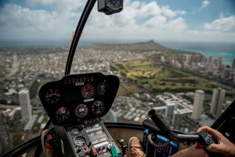 the cockpit of a plane is shown with a view of the city